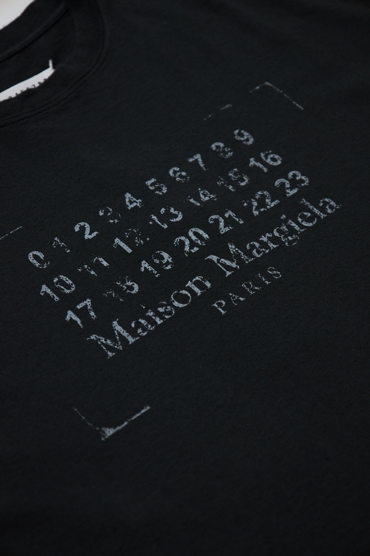 Maison Margiela Logo Stamp Tee Black – ESSXNYC Maison Margiela Logo Stamp Tee Black – ESSXNYC